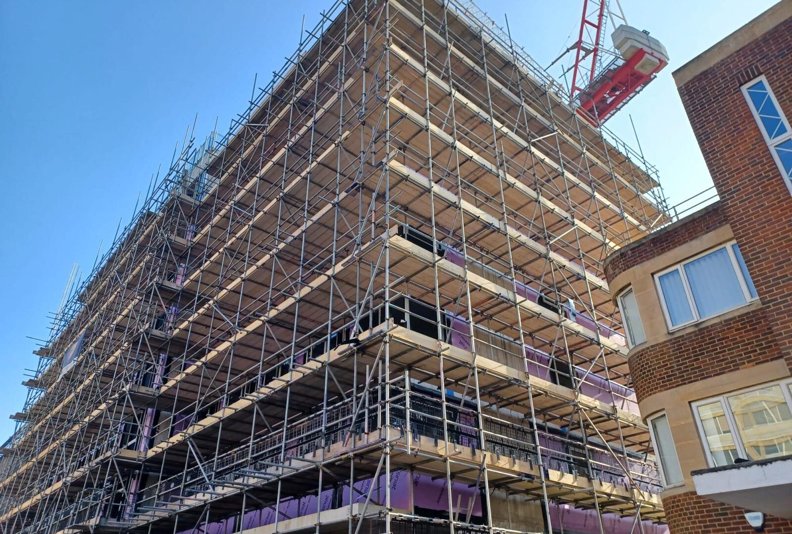 Fully boarded access scaffold around Hendy House in Bournemouth