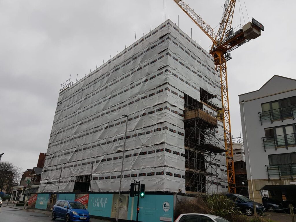 Sheeted access scaffolding around Canaway Court in Poole