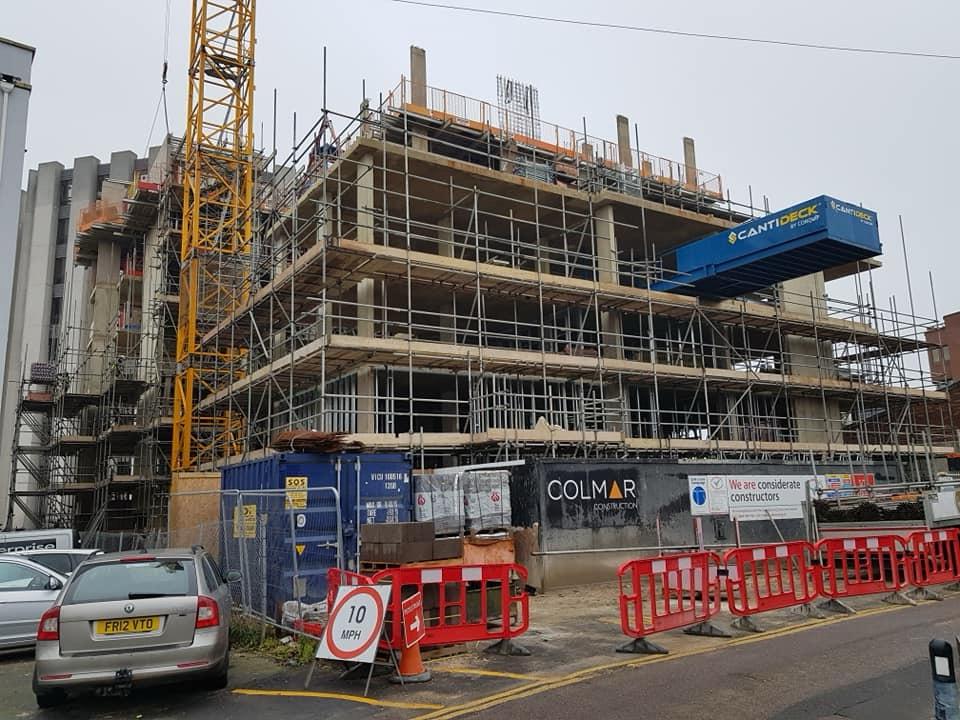 Street-side access scaffolding and site barriers at Canaway Court in Poole
