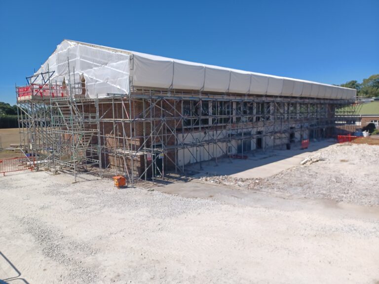 Sheeted temporary roof and perimeter access scaffold at Poole Grammar School in Poole
