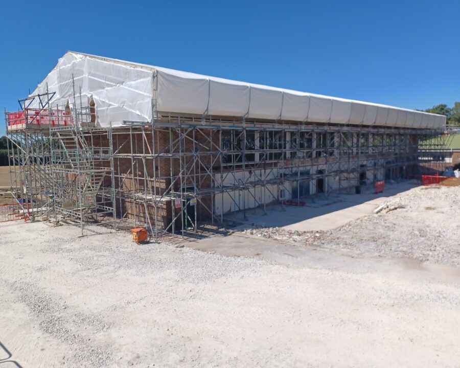 Sheeted temporary roof and perimeter access scaffold at Poole Grammar School in Poole