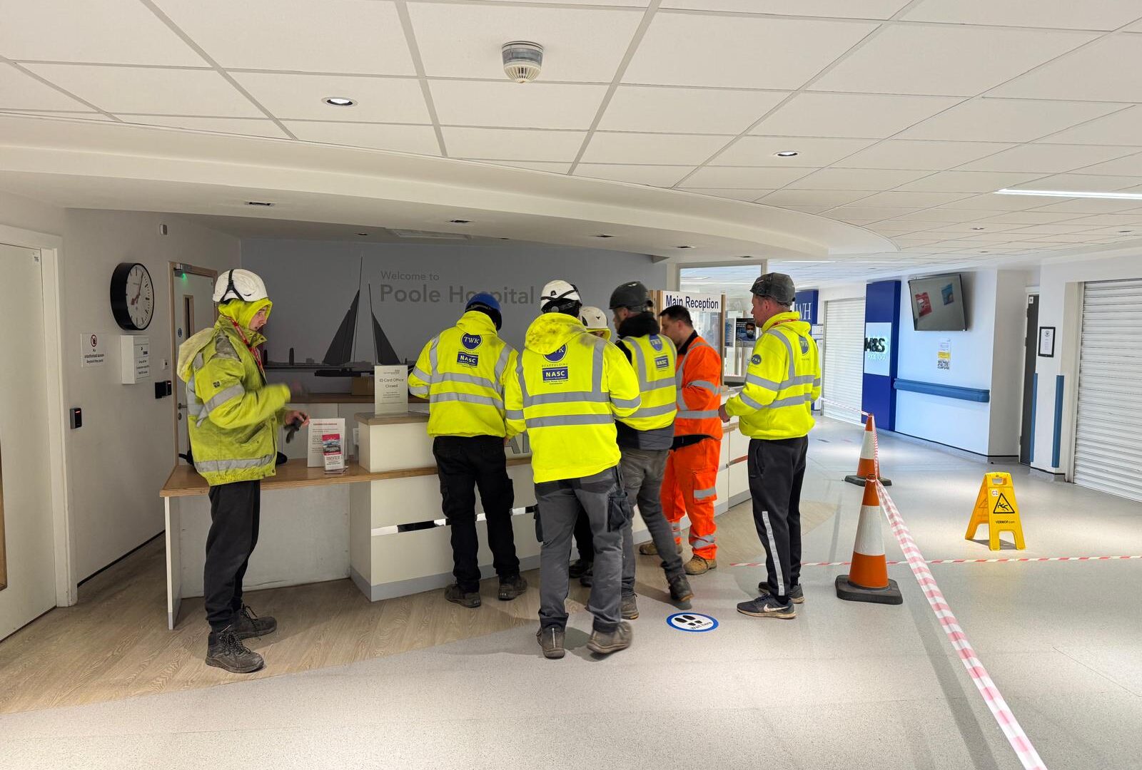 TWK scaffold team and materials in a reception area at Poole Hospital