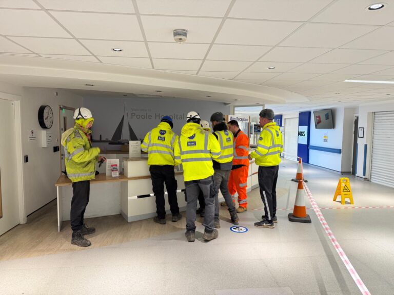 TWK scaffold team and materials in a reception area at Poole Hospital